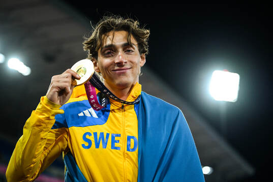 Armand Duplantis of Sweden celebrates with his gold medal
