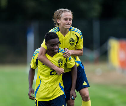 Mikel Alex and Milton Standar of Sverige celebrates